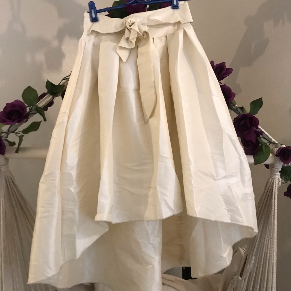 Pleated satin high low skirt with bow